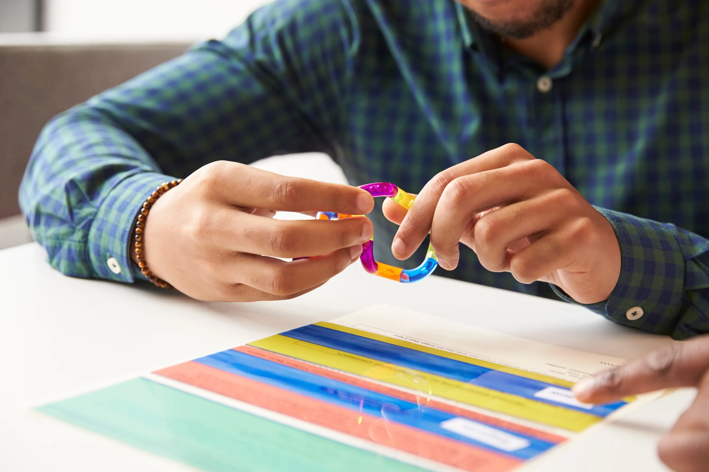 close up of student with dyslexia using colored overlay
